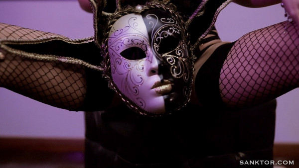 Hot striptease in a carnival mask